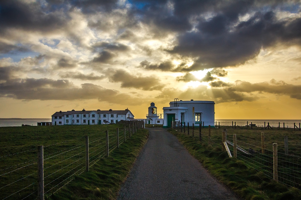 lighthouse in the evening clouds free photo