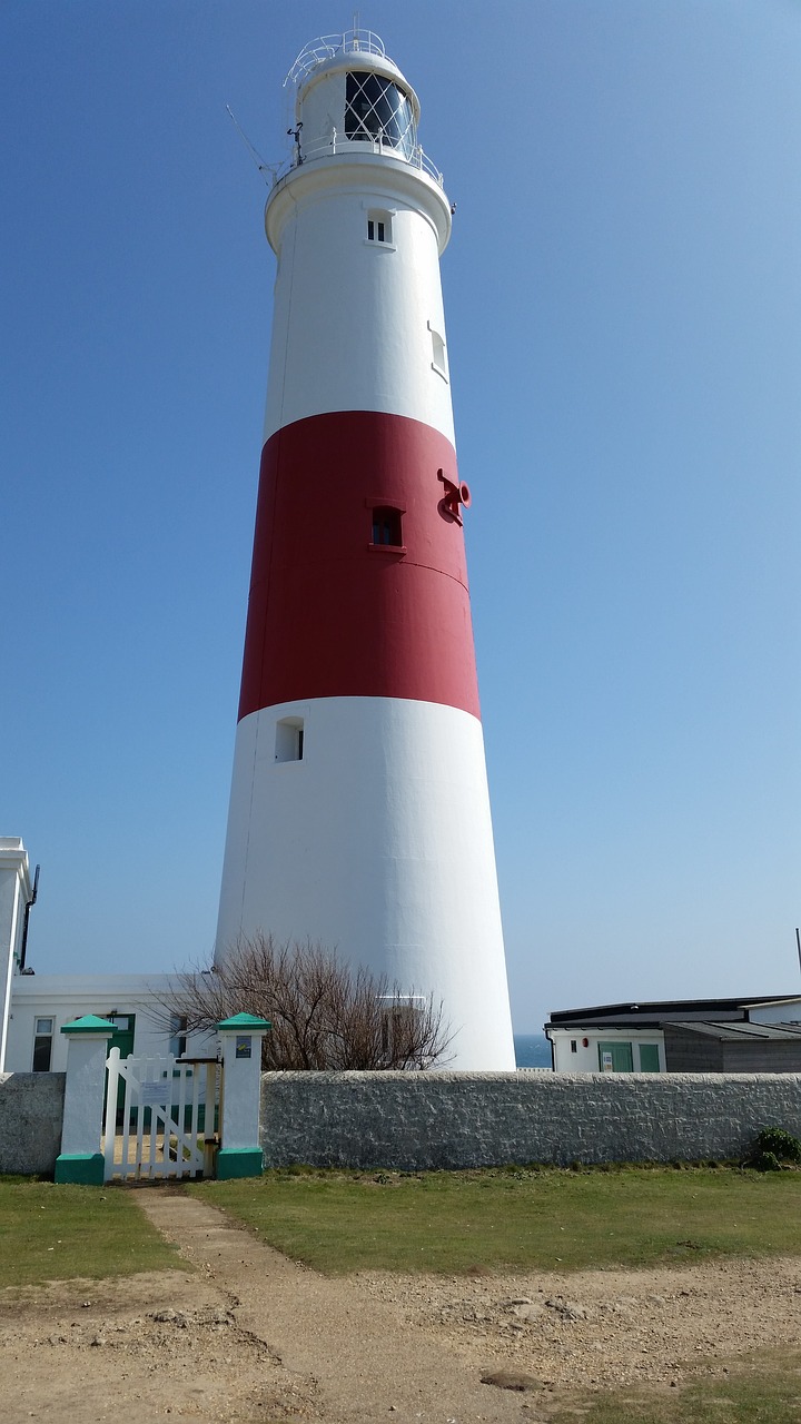 lighthouse portland bill blue sky free photo