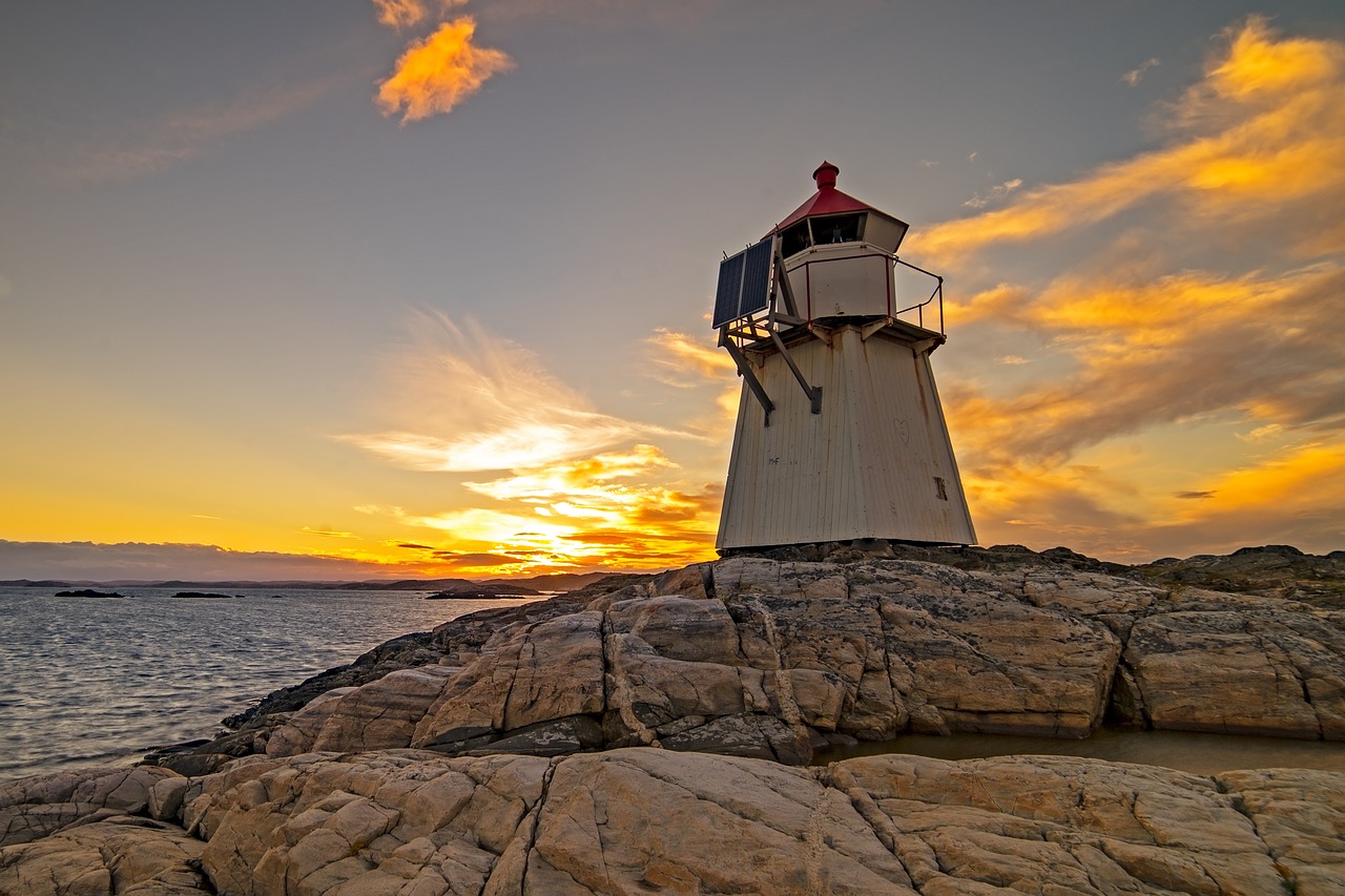 lighthouse ocean sunset free photo