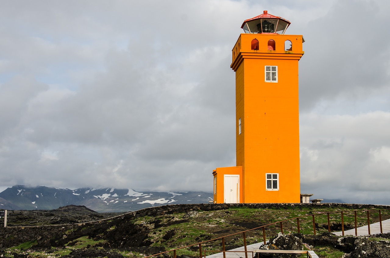 lighthouse orange sea free photo