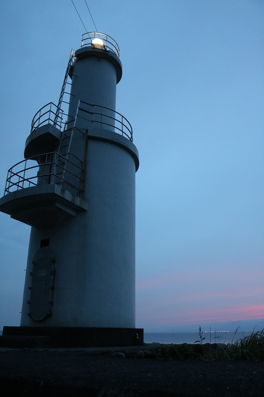 lighthouse sea sunset free photo