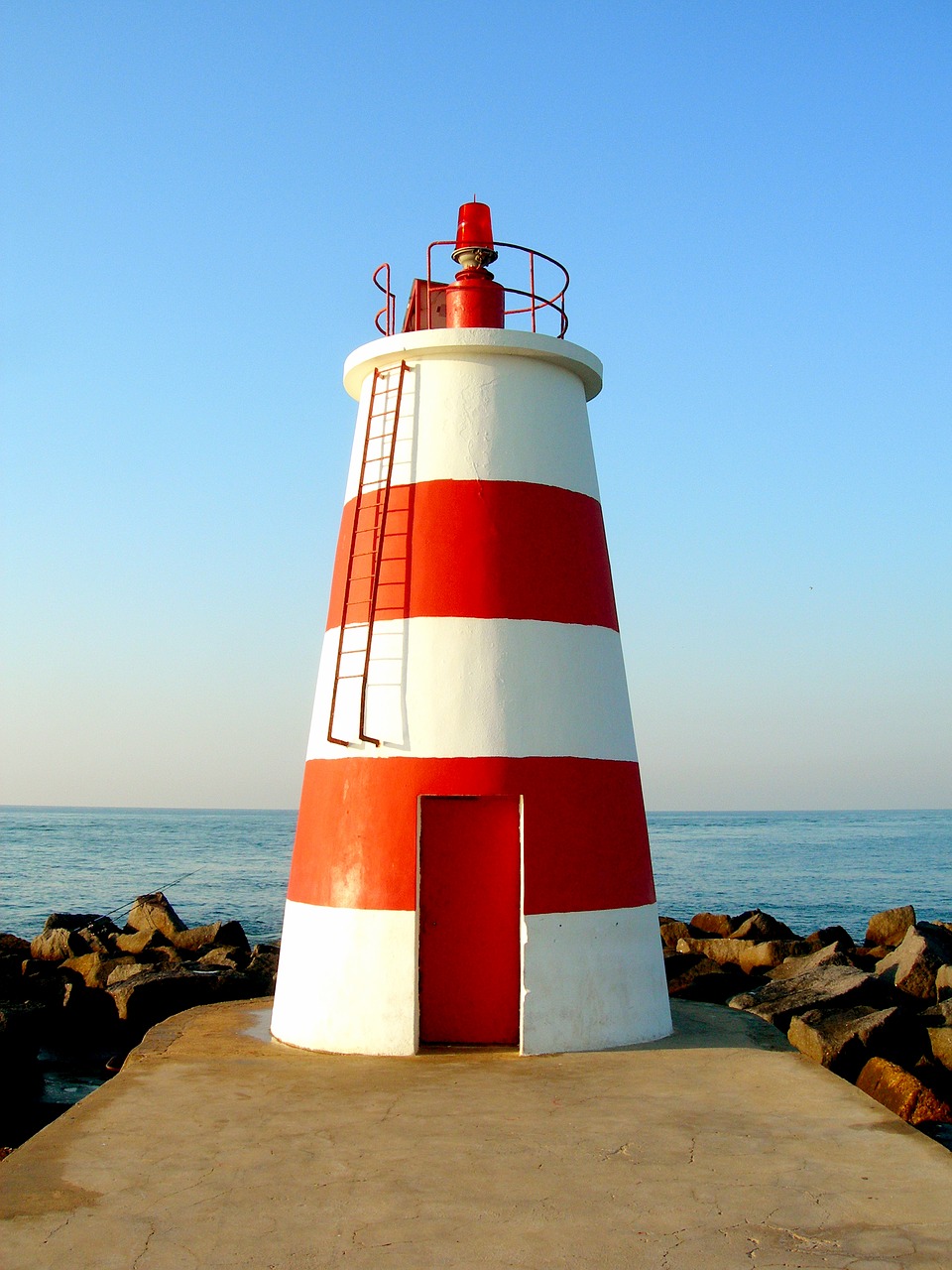 lighthouse rock blue free photo