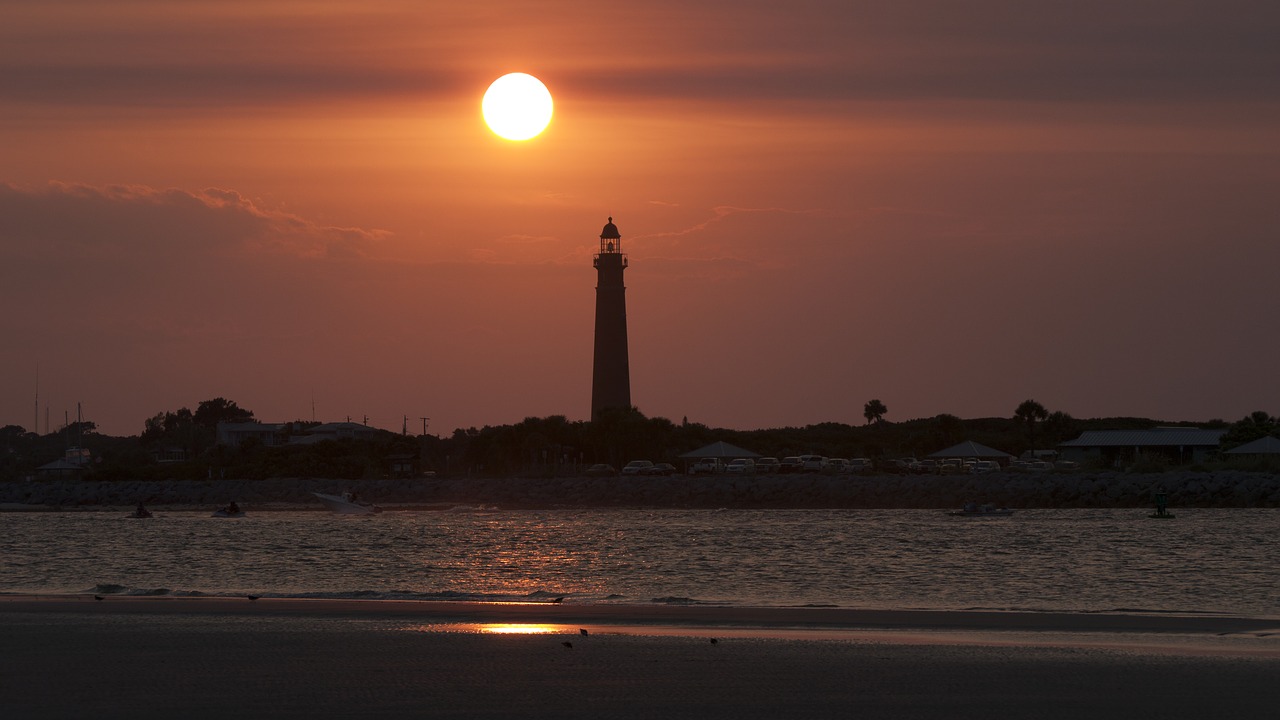 lighthouse sunset beach free photo