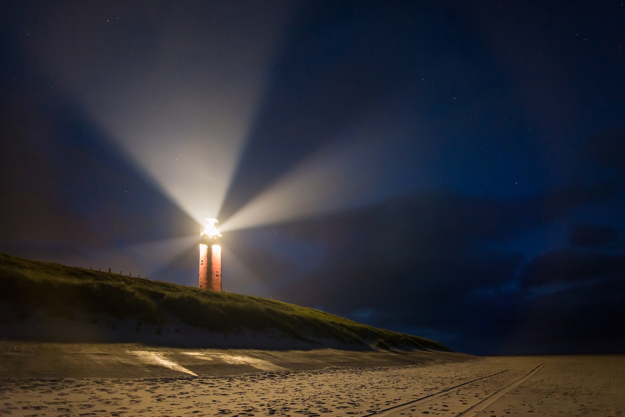lighthouse night beacon free photo