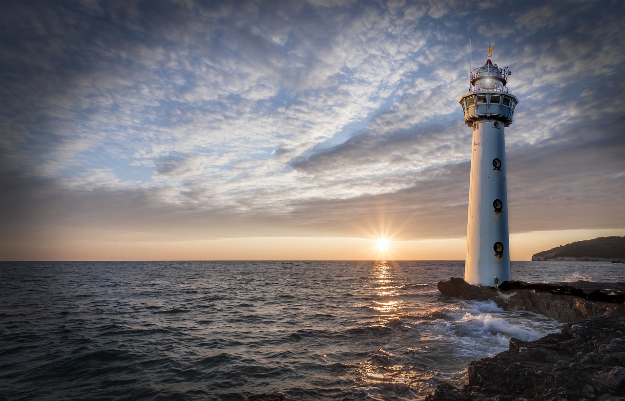 lighthouse glow evening free photo