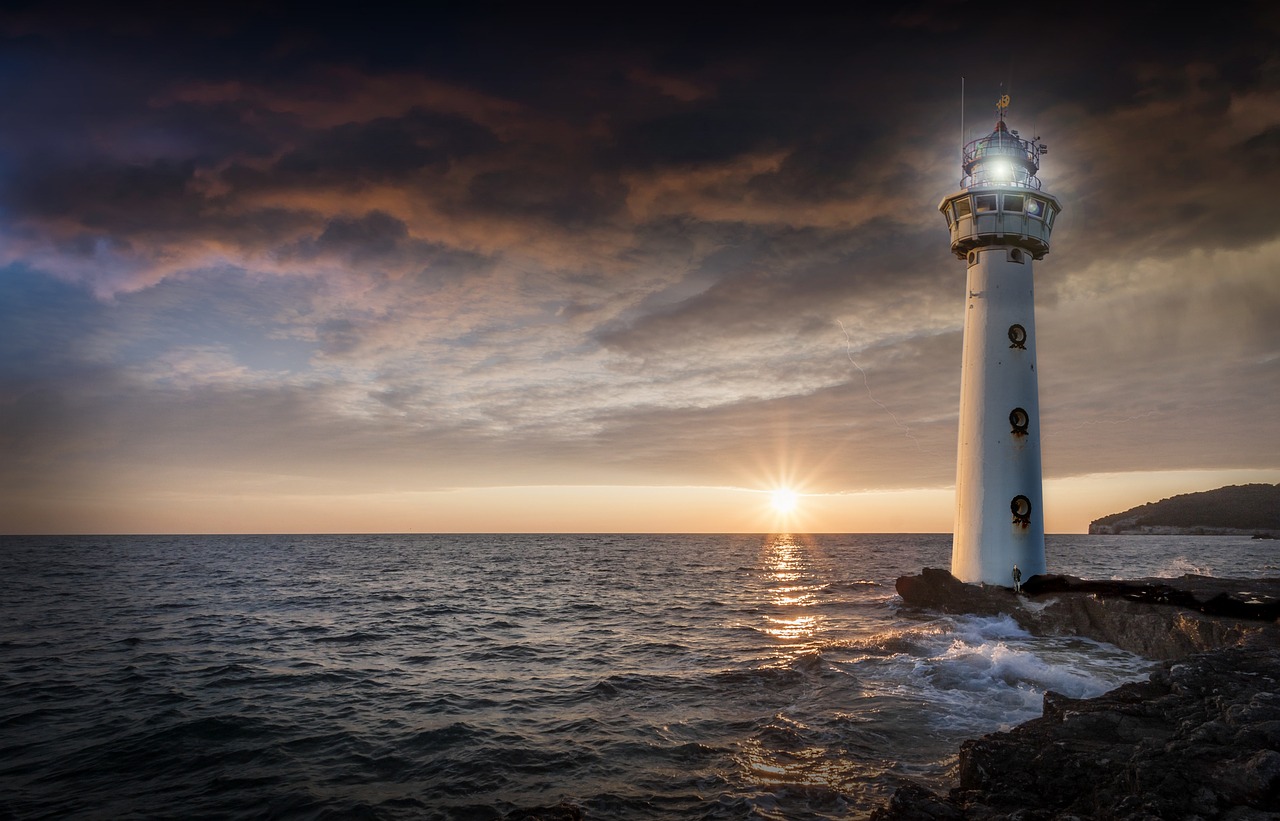 lighthouse glow evening free photo