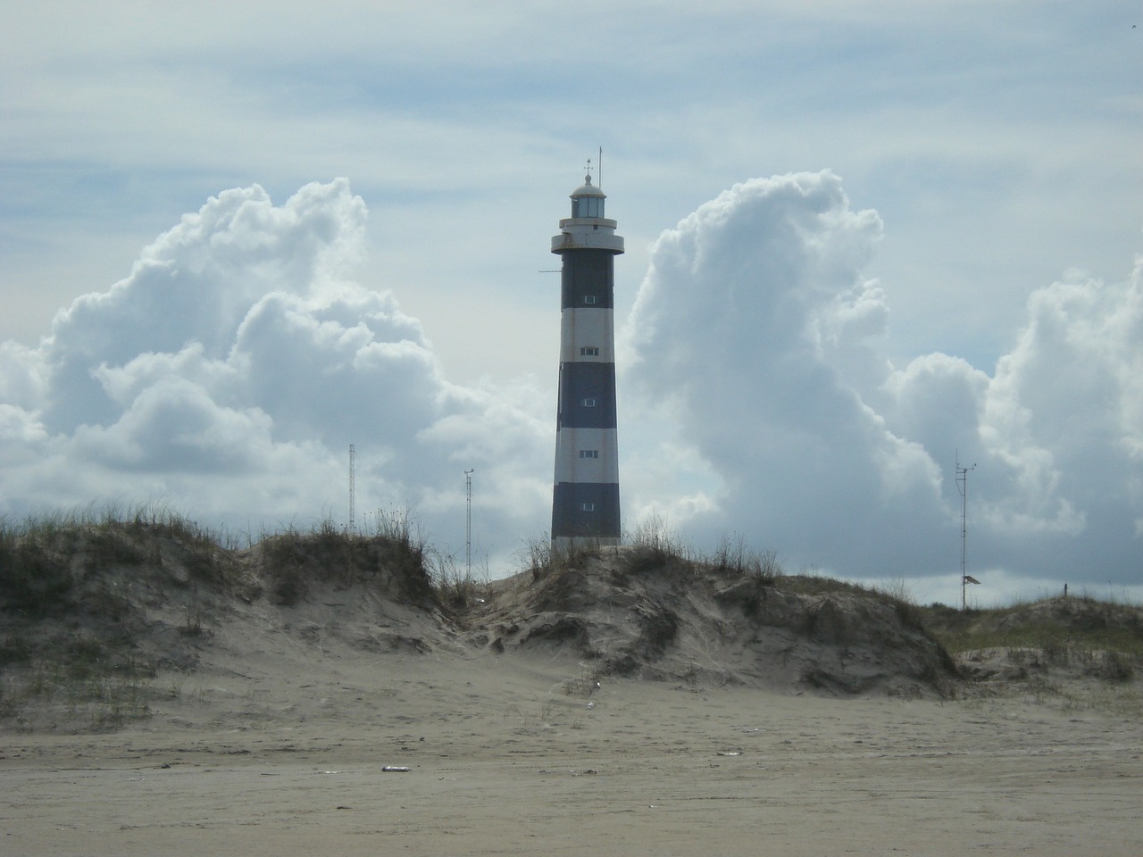 lighthouse loneliness beach cloud free photo