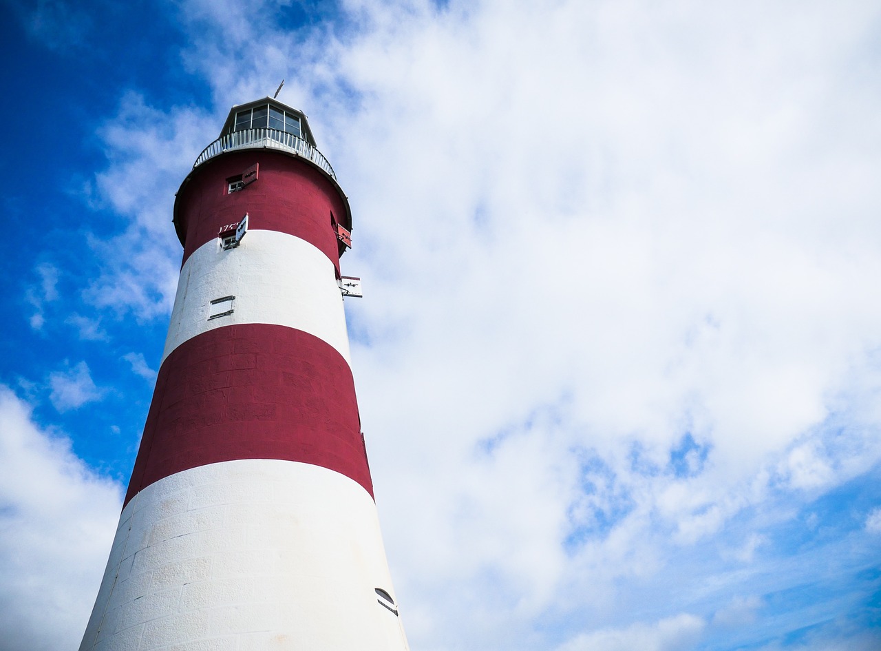 lighthouse clouds sky free photo