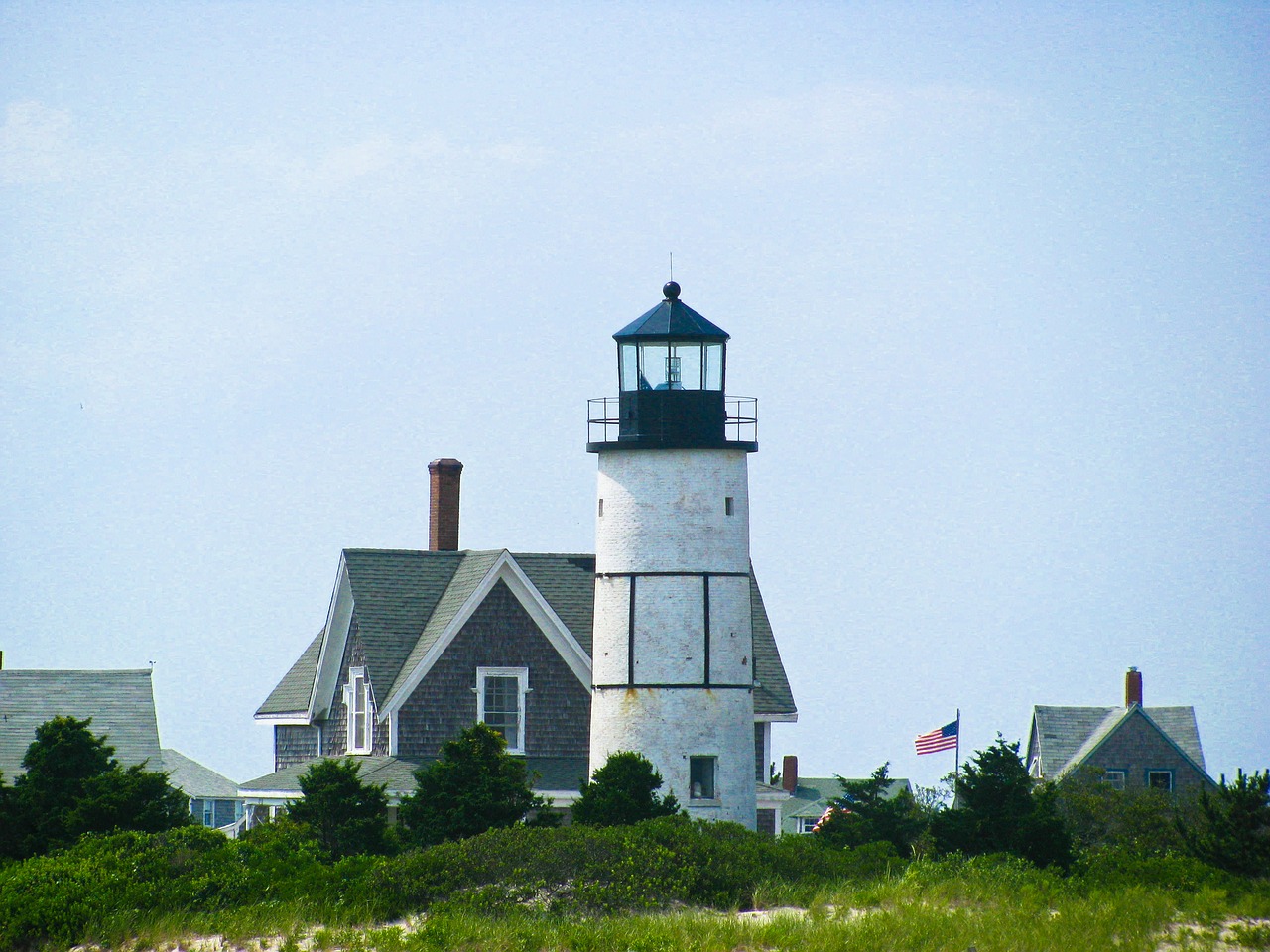 lighthouse houses flag free photo
