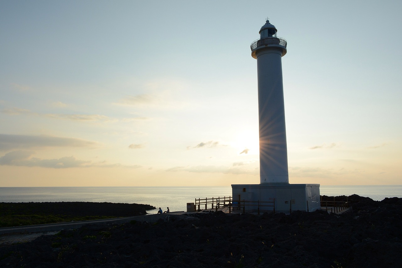 lighthouse sunset sea free photo