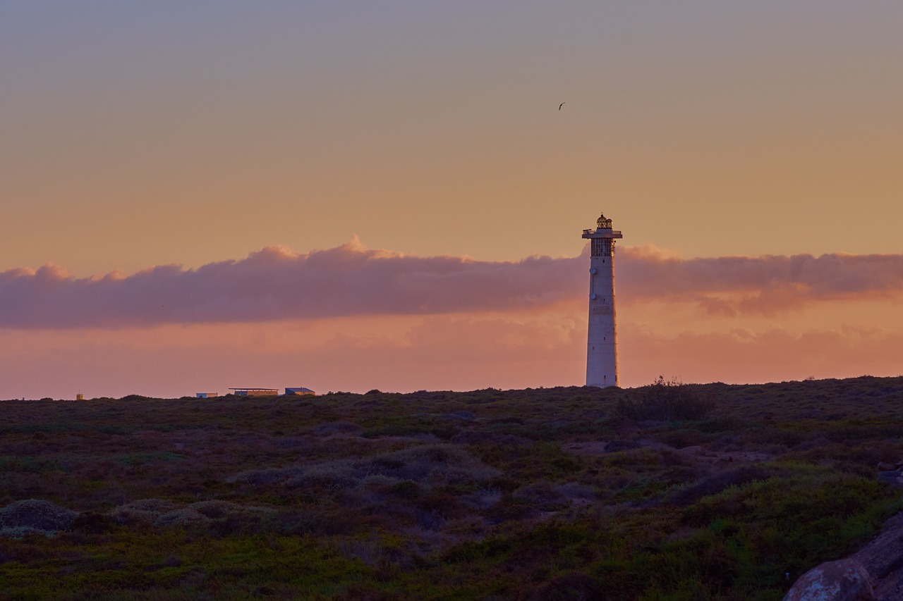 lighthouse beach sea free photo