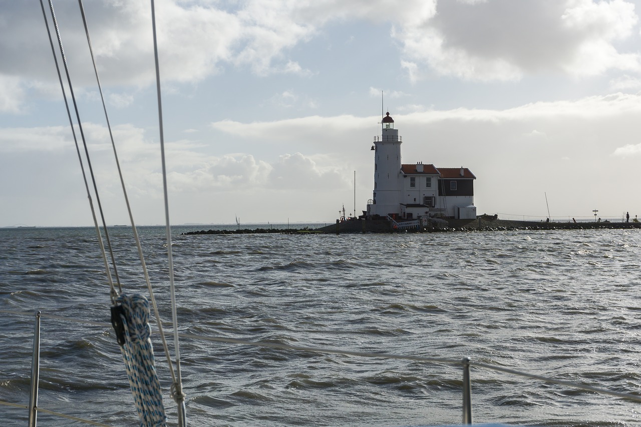 lighthouse marks boat free photo