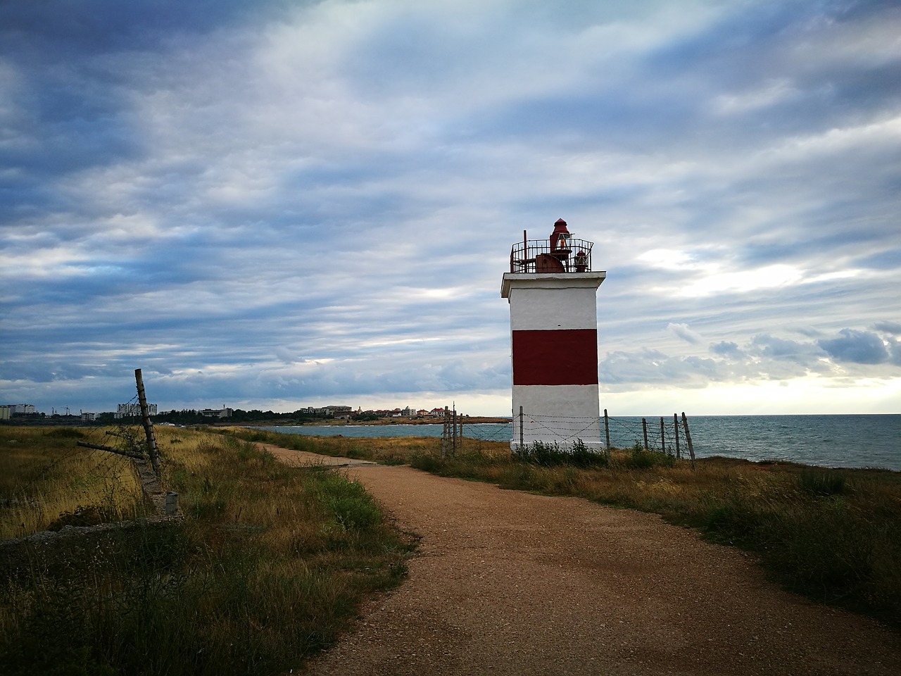 lighthouse  coast  sky free photo