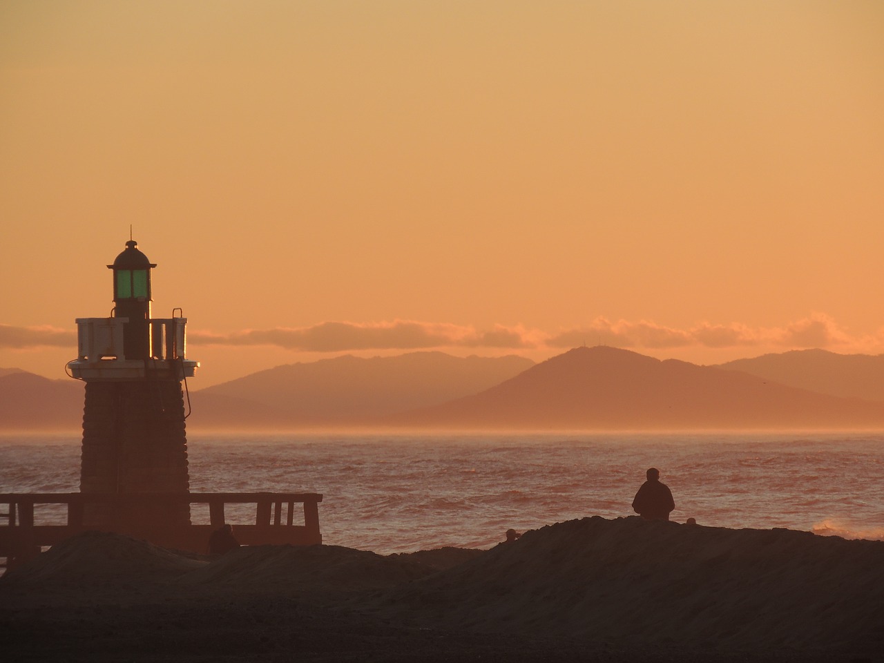 lighthouse  sunset  sun free photo