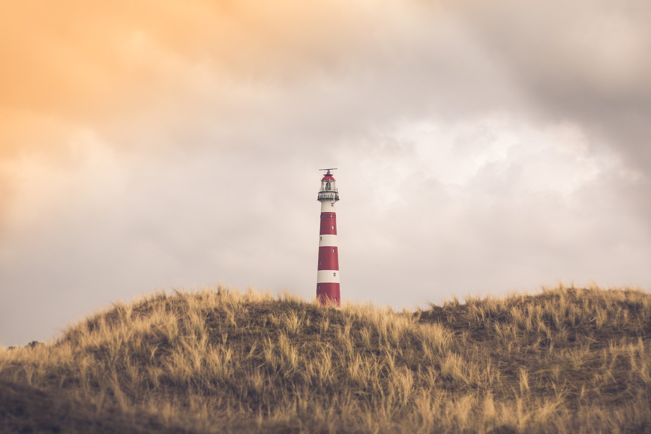 lighthouse  beach  sea free photo