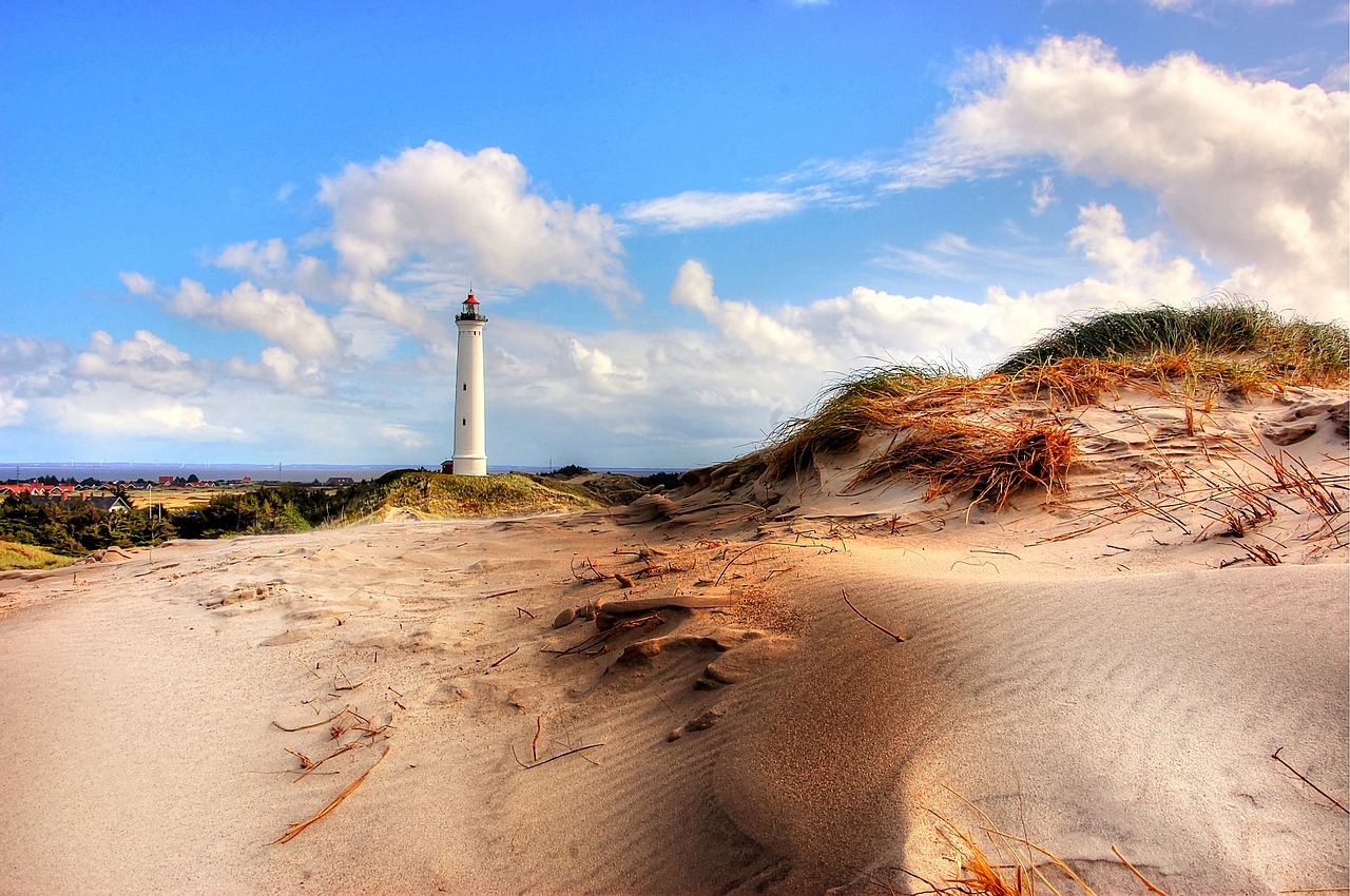 lighthouse  beach  sea free photo