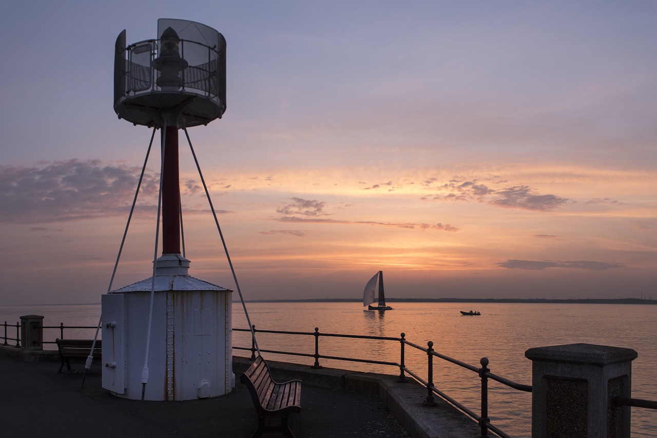 lighthouse  sunset  yacht free photo