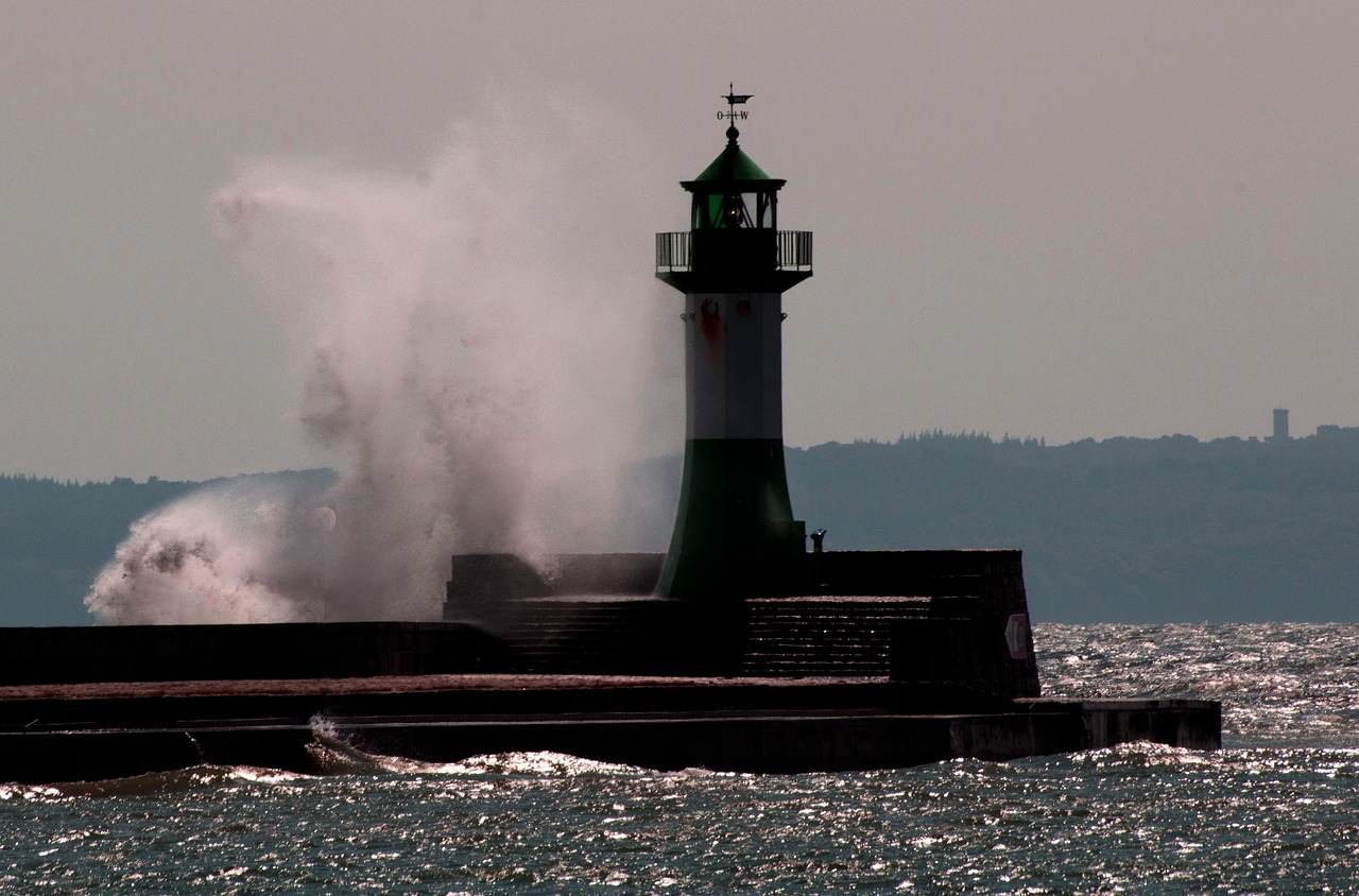 lighthouse  wave  sea free photo