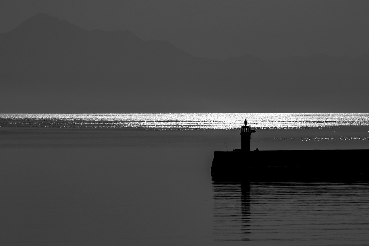 lighthouse  sunrise  sea free photo