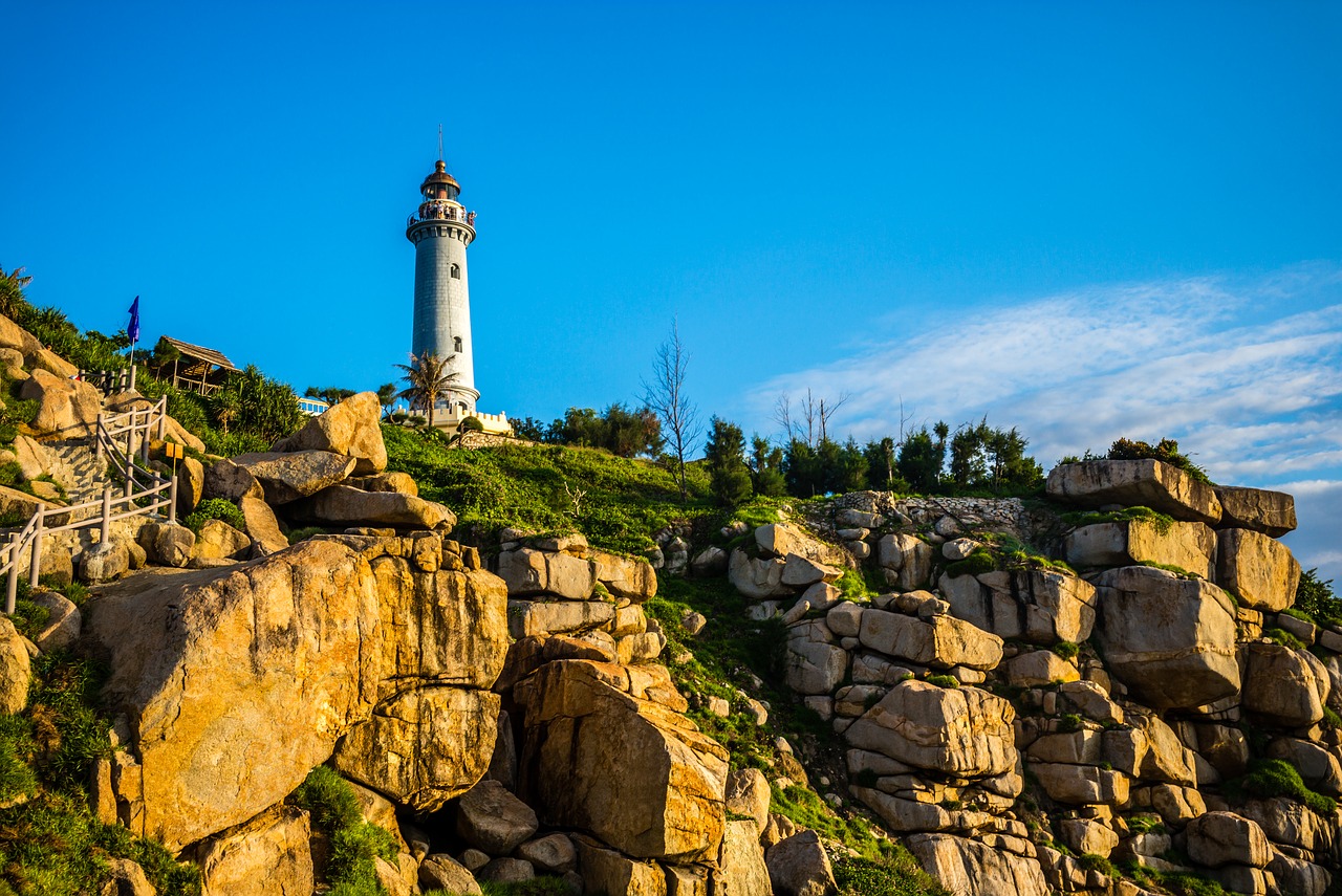 lighthouse  sea  sunset free photo