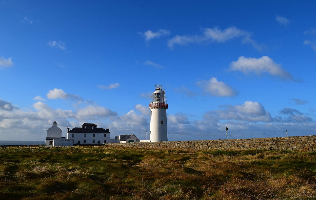 lighthouse  landscape  sky free photo