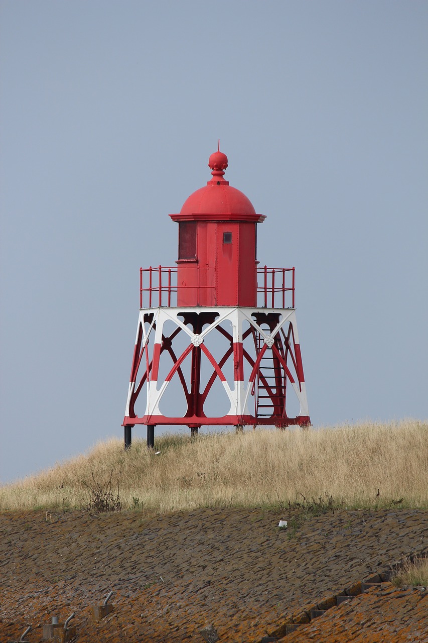 lighthouse  holland  sea free photo