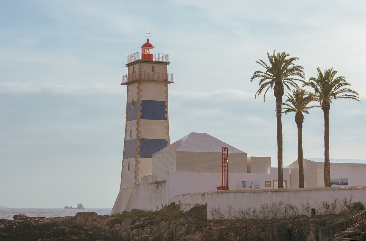 lighthouse  water  beach free photo