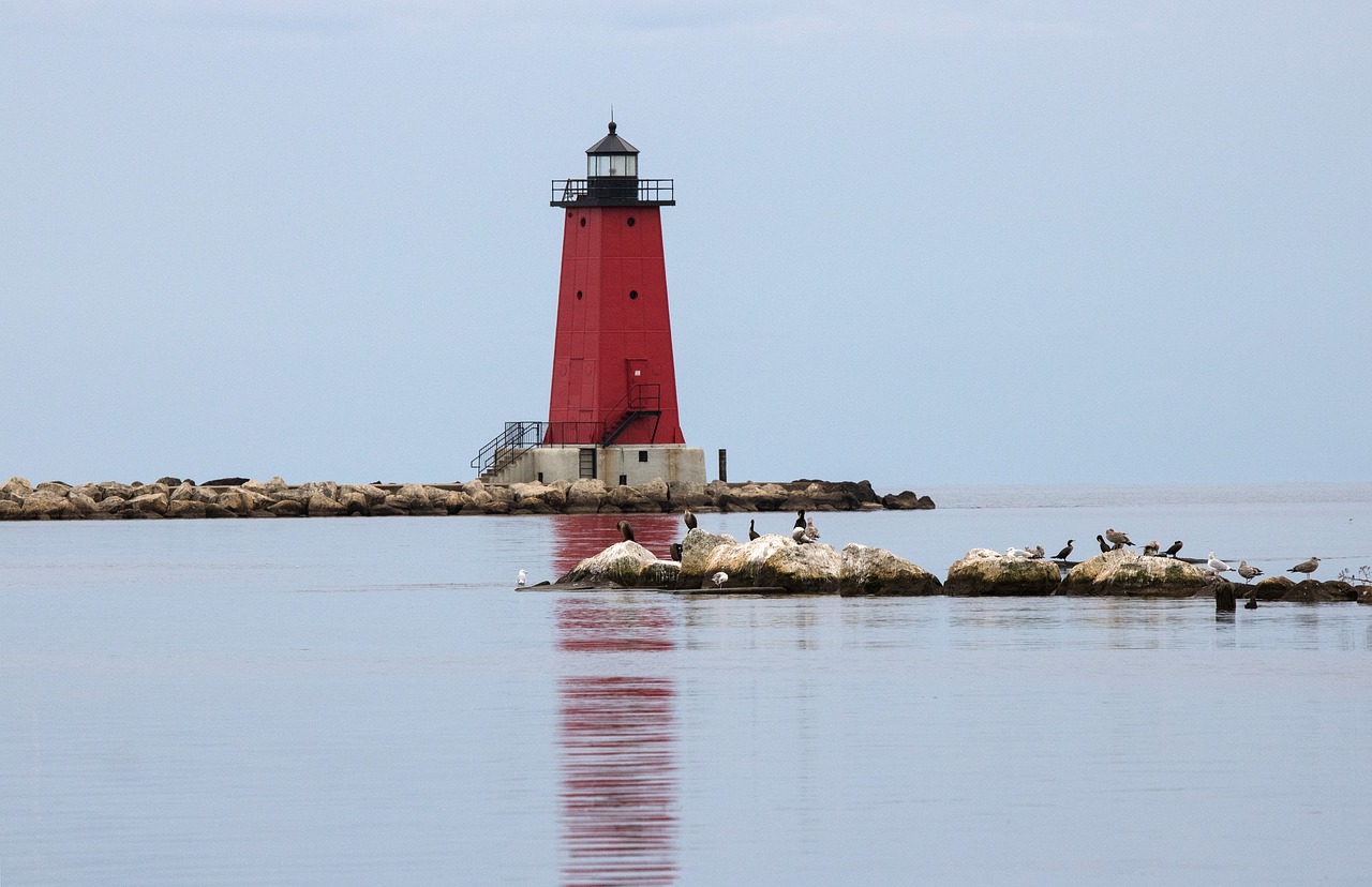 lighthouse  lake michigan  rocks free photo
