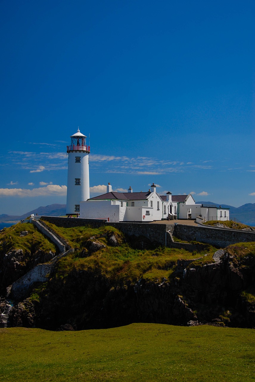 lighthouse  sky  clouds free photo