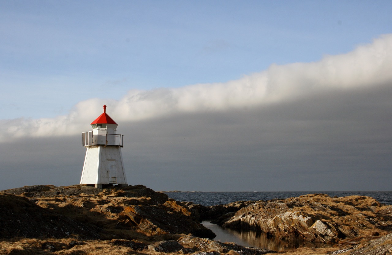 lighthouse  ocean  clouds free photo