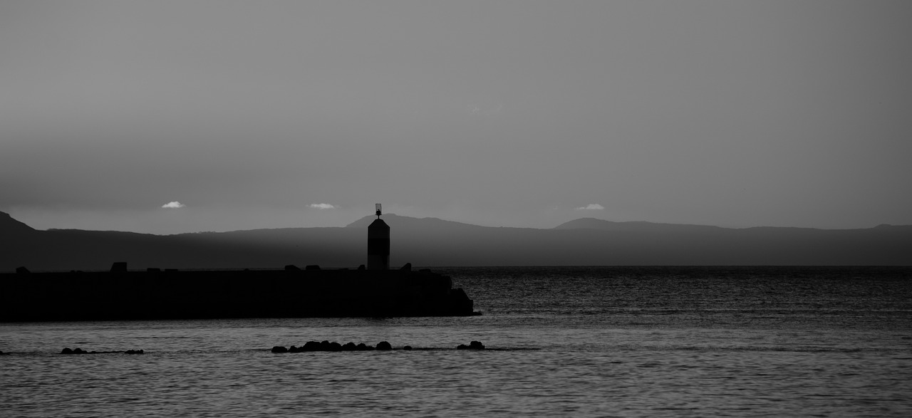 lighthouse  ocean  blackandwhite free photo