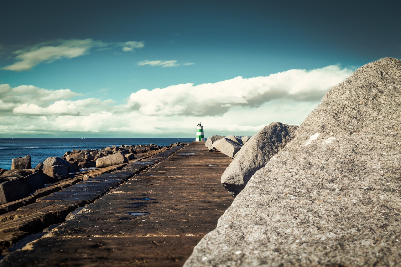 lighthouse  sun  jetty free photo