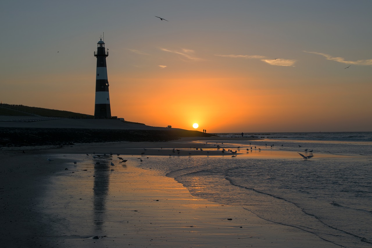 lighthouse  beach  sunset free photo