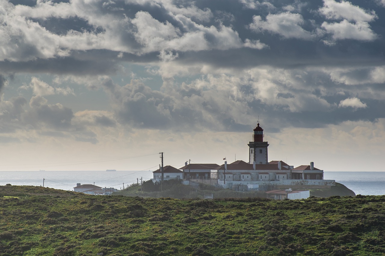 lighthouse  landscape  clouds free photo