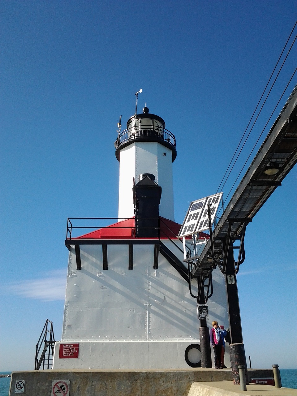 lighthouse pier water free photo