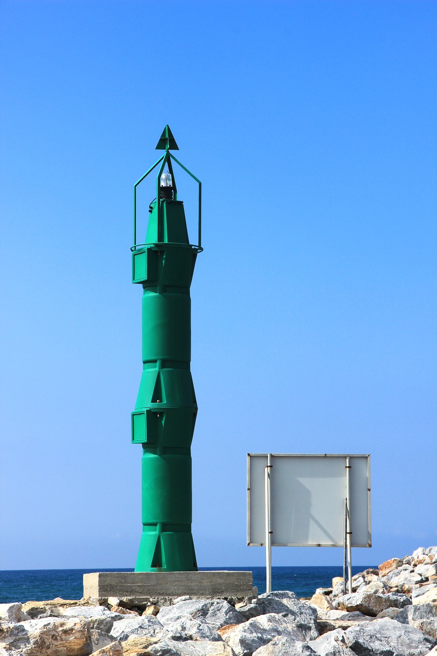 lighthouse green sea free photo