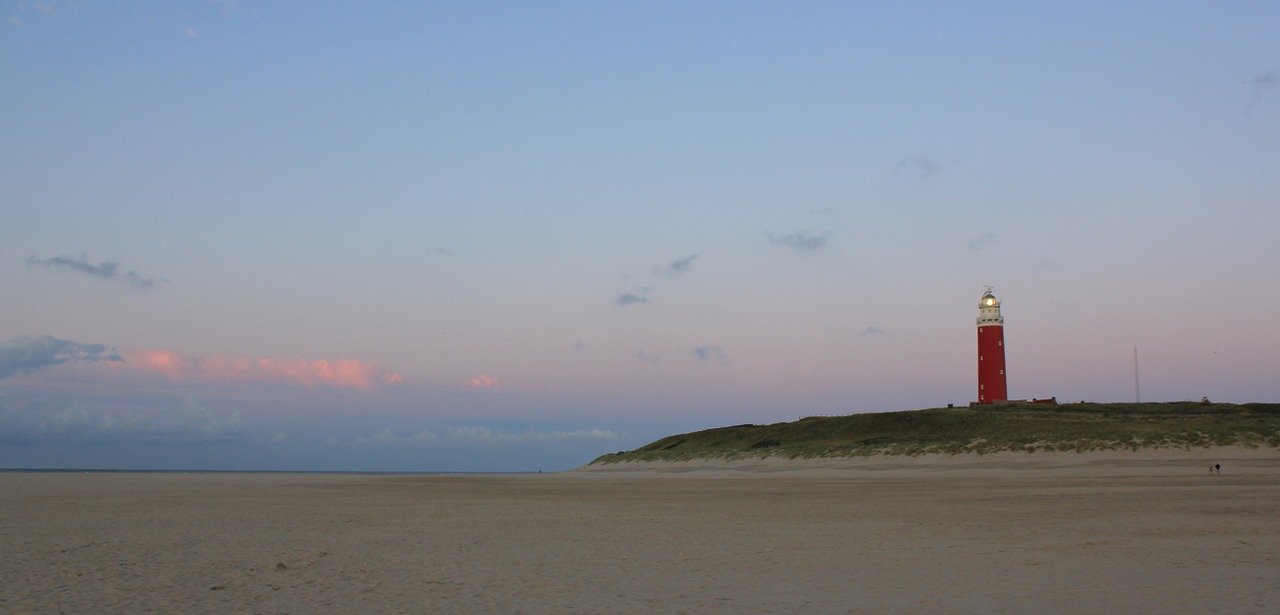 lighthouse evening sky sand free photo