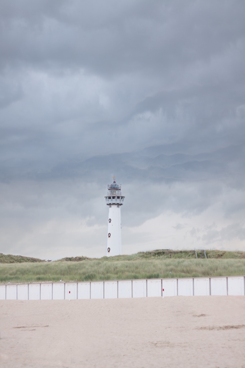 lighthouse beach clouds free photo