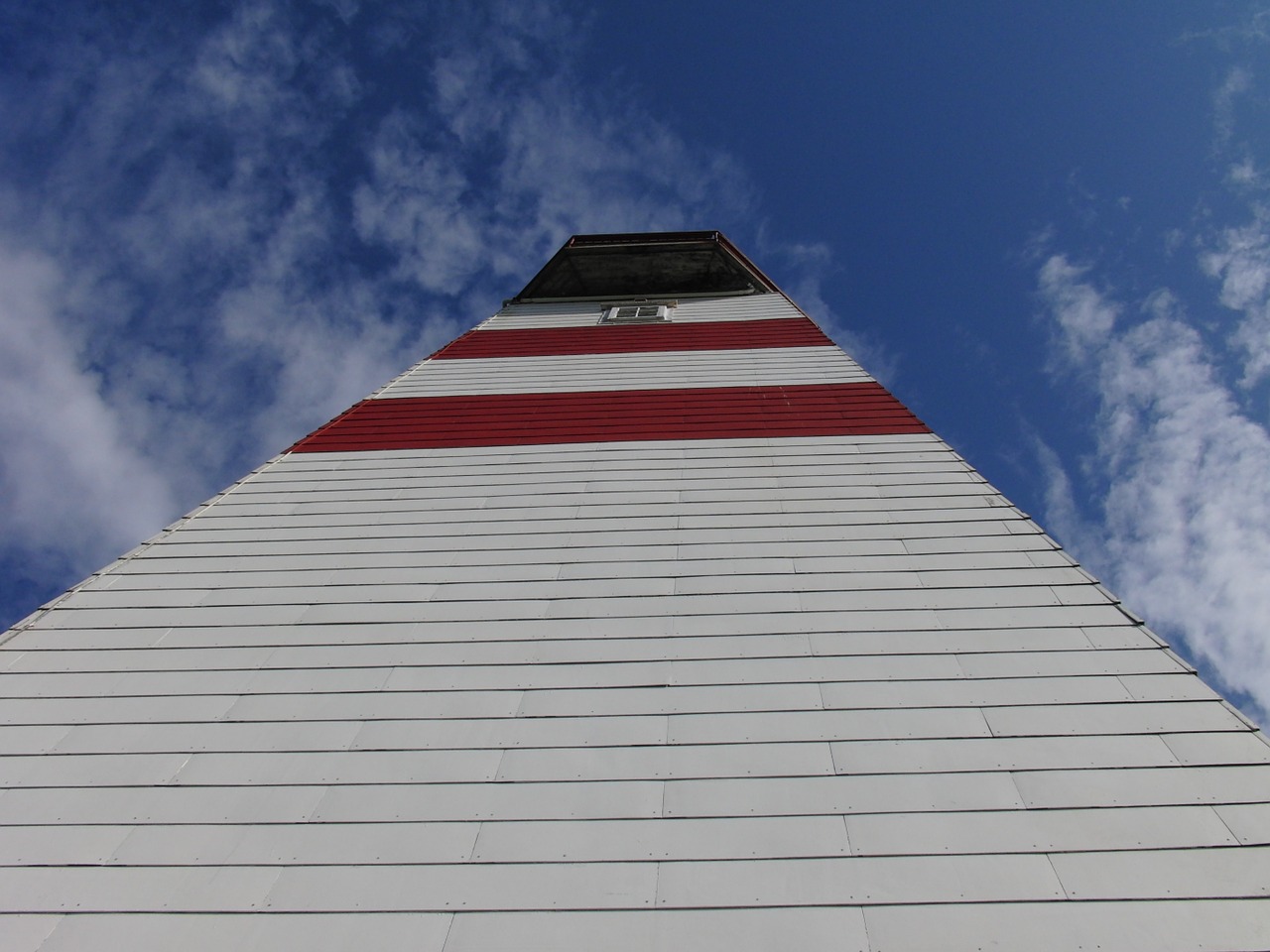 lighthouse blue sky ocean free photo
