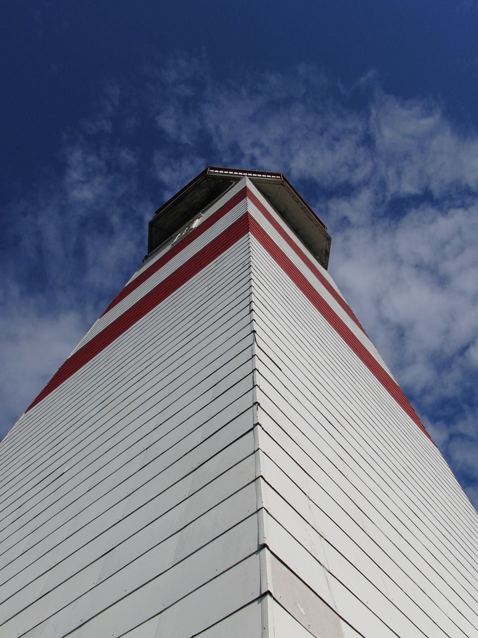 lighthouse blue sky ocean free photo