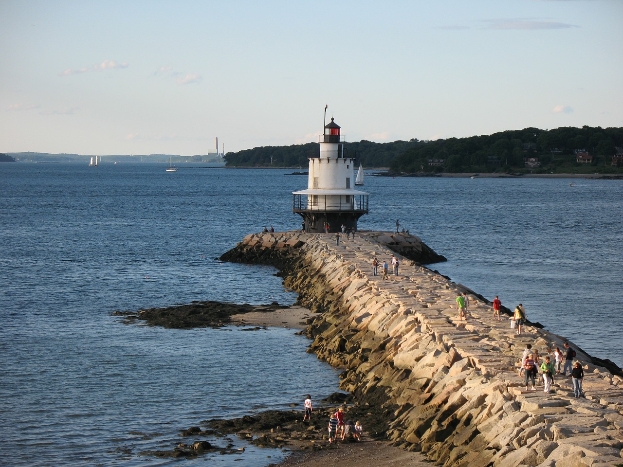 lighthouse breakwater water free photo