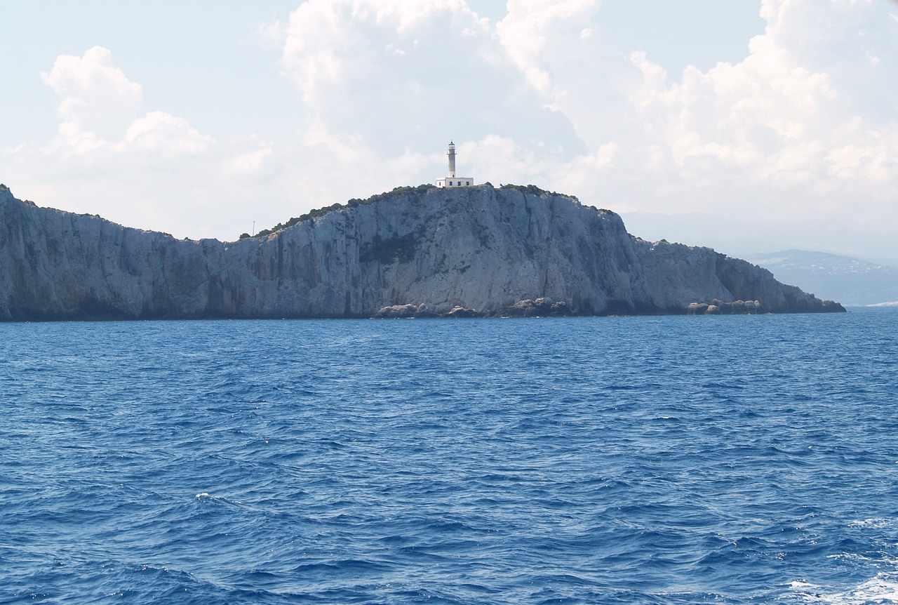 lighthouse rock sea free photo