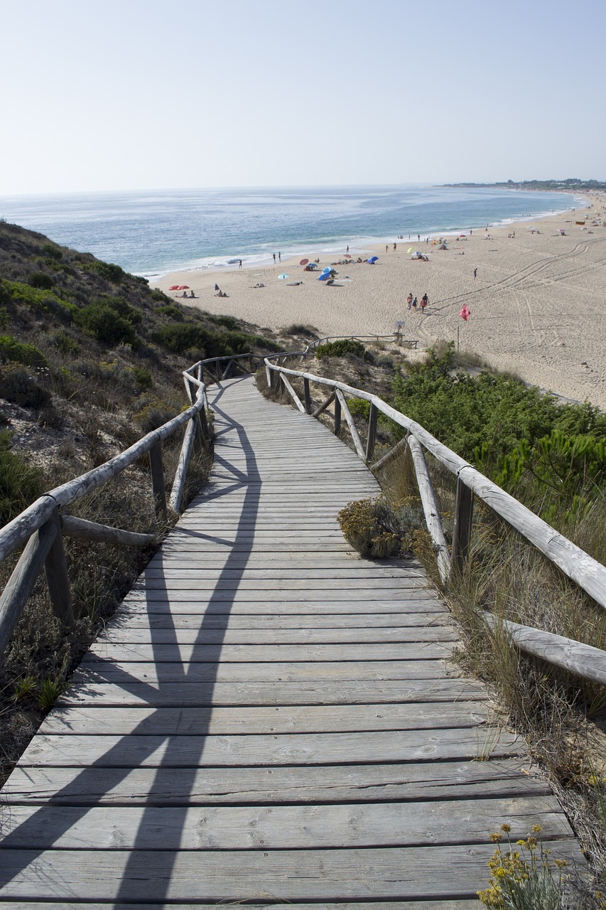 lighthouse of trafalgar beach coast of light free photo