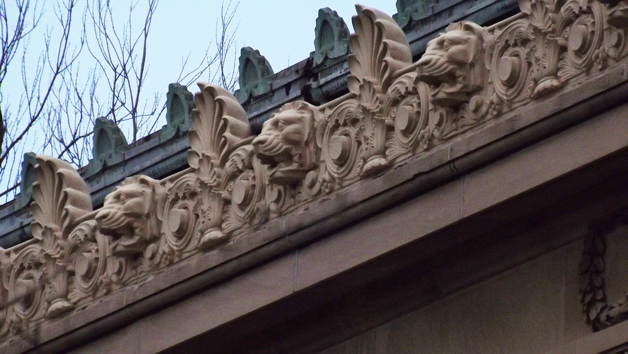 lion heads gargoyles water spouts free photo