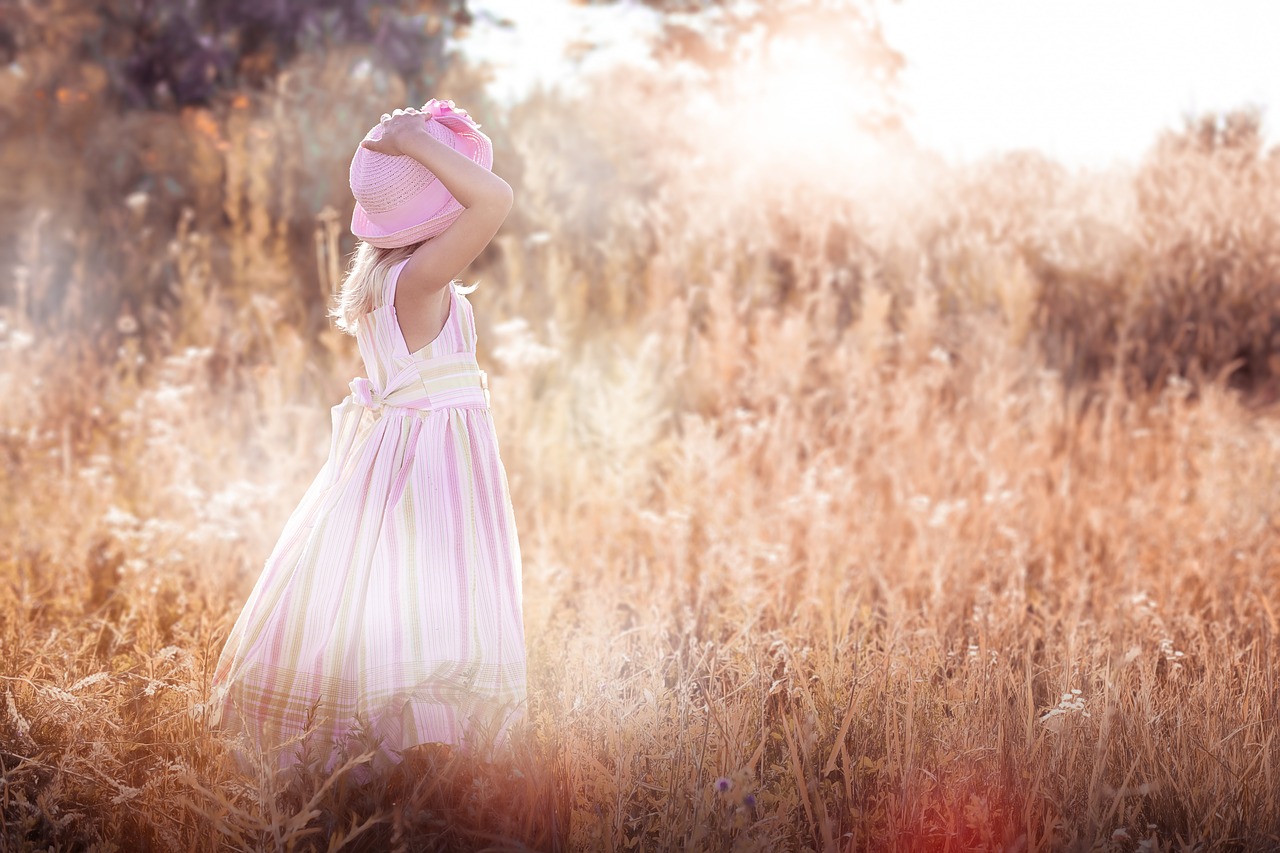 little girl  meadow  wildflowers free photo