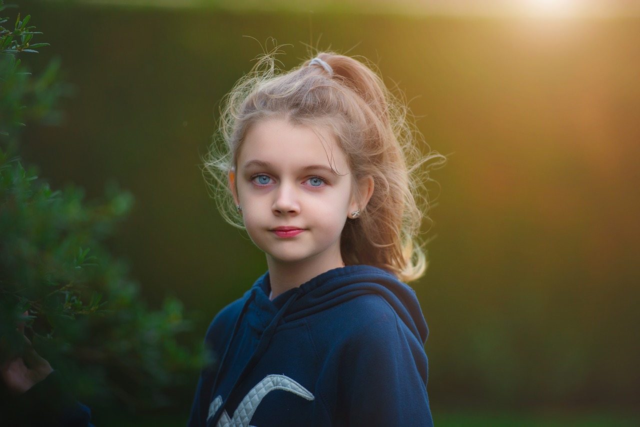 little girl  wildflowers  meadow free photo