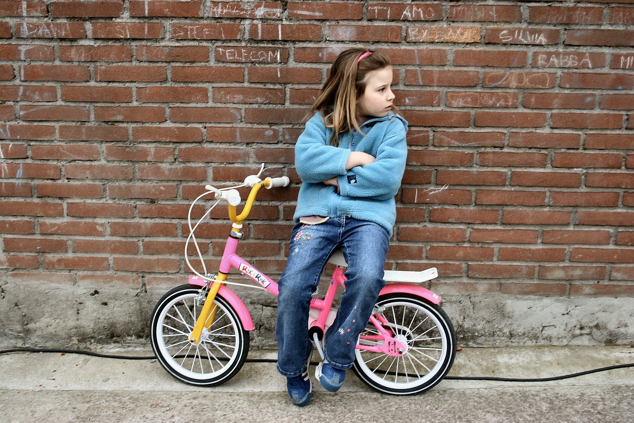 little girl  bicycle  boredom free photo