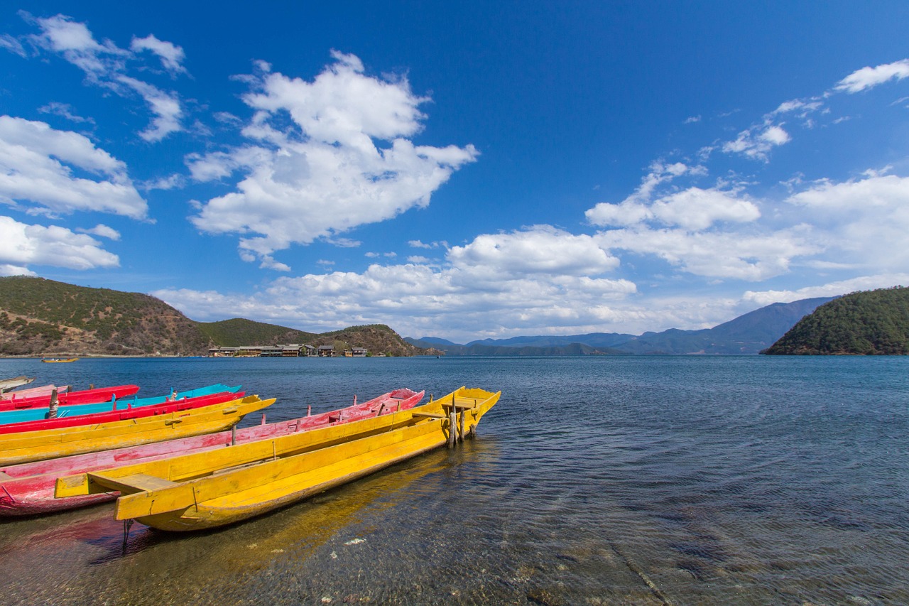 lugu lake lake wooden boat free photo