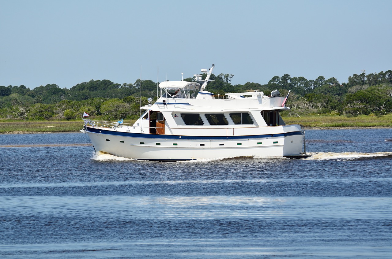 luxury yacht cruising river free photo