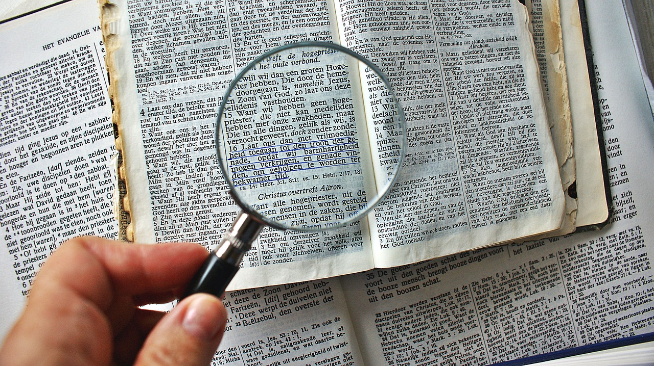 magnifying glass  to enlarge  book free photo